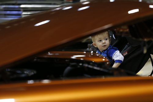 JOHN WOODS / WINNIPEG FREE PRESS Haiden Humphrey, 1, and his dad check out the cars at the World of Wheels  in Winnipeg Saturday, March 19, 2016.