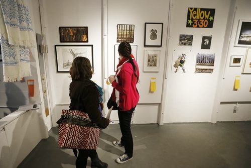 JOHN WOODS / WINNIPEG FREE PRESS People check out the art at the Mentoring Artists for Women's Art (MAWA) fundraiser Over The Top Art Auction and Cupcake Party in Winnipeg Sunday, March 20, 2016. MAWA supports women visual artists through mentorship, education and critical dialogue.
