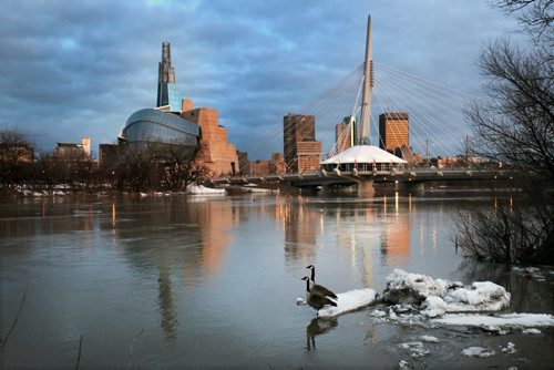 JOE BRYKSA / WINNIPEG FREE PRESS  Early morning light illuminates the downtown skyline Monday morning in Winnipeg, March 21, 2016.(Standup Photo