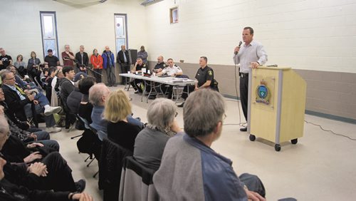 Canstar Community News Mike Brooker of the Winnipeg Police Service addresses a packed house at the Corydon Community Centre on May 13. (DANIELLE DASILVA/CANSTAR/SOUWESTER.