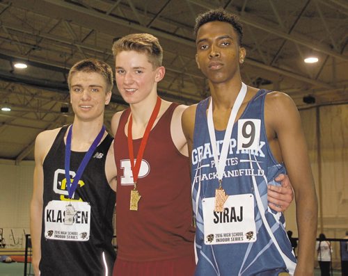 Canstar Community News Jack Taylor of St. Paul's High School (centre) won the junior men's 1,500 metres in a time of 4:35.51 at the 2016 High School Series provincial indoor athletics championship on March 17. Matthew Klassen of Garden City Collegiate (left) was second, while Fathi Siraj of Grant Park High School (right) finished third.