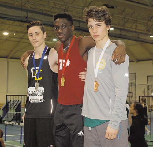 Canstar Community News Matt Indome of St. Paul's High School (centre) won the junior men's 60 metres in a time of 7.35 seconds at the 2016 High School Series provincial indoor athletics championship on March 17. Jordan Giancola of Garden City Collegiate (left) was second, while Sascha Regnier of College Louis-Riel (right) finished third.
