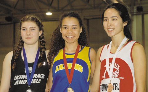 Canstar Community News Nicole Davis of J.H. Bruns Collegiate (centre) won the junior women's 200 metres in a time of 26.68 seconds at the 2016 High School Series provincial indoor athletics championship on March 17. Daniele Dyck of Brandon's Vincent Massey High School (left) was second, while Tracy Towns of Shaftesbury Collegiate (right) finished third.
