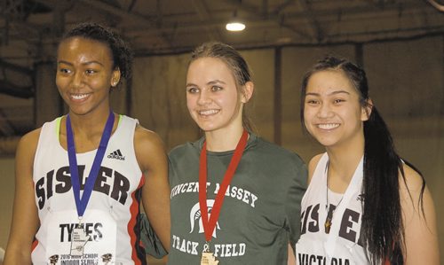 Canstar Community News Victoria Tachinski of Vincent Massey Collegiate (centre) won the senior women's 200 metres in a time of 25.05 seconds at the 2016 High School Series provincial indoor athletics championship on March 17. Brianna Tynes of Sisler High School (left) was second, while Ashley Victoria of Sisler (right) finished third.