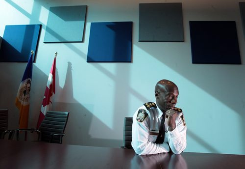 PHIL HOSSACK / WINNIPEG FREE PRESS Winnipeg Police Chief Devon Clunis crunches the numbers from the perspective of his new boardroom on Donald street's new HQ building on the eve of the city budget passing. See Katie May's story   MARCH 17, 2016