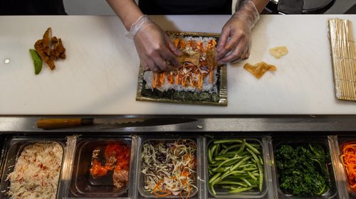 MIKE DEAL / WINNIPEG FREE PRESS Chosabi Asian Eatery 100A King Street Preparation of a King Street Chicken sushi burrito. 160321 - Monday, March 21, 2016