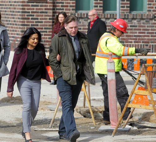 BORIS MINKEVICH / WINNIPEG FREE PRESS Manitoba Liberals to Make Infrastructure Announcement. Rana Bokhari and Mb Liberal candidate Ian McCausland in the Assiniboia riding walk away after the presser near Broadway and Furby (Northwest Corner). Photo taken March 21th, 2016