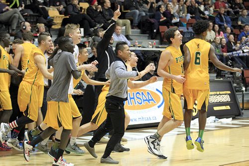 PHIL HOSSACK / WINNIPEG FREE PRESS John Taylor Pipers rush the court to celebrate their win over the Garden City Gophers during the MHSAA Basketball Championship final Monday at Investor's Group Athletic Center.  MARCH 21, 2016