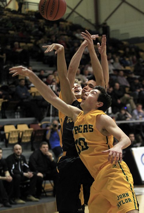 PHIL HOSSACK / WINNIPEG FREE PRESS John Taylor Piper's #10 Risto Zimbakov and #5 Zach Giesbrecht sandwich Garden City Gopher's #6 Dylan Tagle during the MHSAA Basketball Championship final Monday at Investor's Group Athletic Center.  MARCH 21, 2016