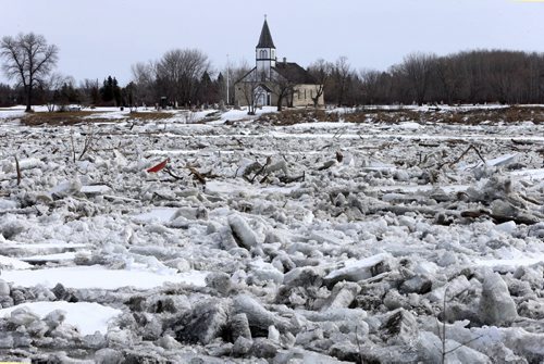 WAYNE GLOWACKI / WINNIPEG FREE PRESS    Ice build up on the Red River by the St. Peter, Dynevor Old Stone Church in St. Clements, MB. just south of the Howard Pawley Bridge Tuesday.   March 22 2016