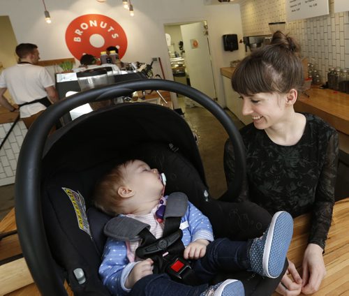 WAYNE GLOWACKI / WINNIPEG FREE PRESS  Meghan Zahari, co-owner of Bronuts in the Exchange district, faced online criticism after breastfeeding her daughter Emelyn in the cafe area.  Shannon Sampert story.  March 23 2016