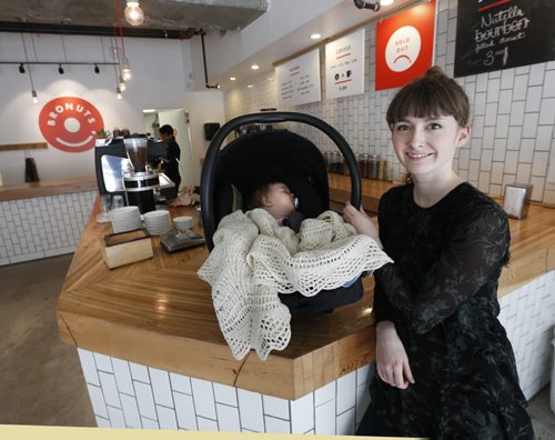 WAYNE GLOWACKI / WINNIPEG FREE PRESS  Meghan Zahari, co-owner of Bronuts in the Exchange district, faced online criticism after breastfeeding her daughter Emelyn in the cafe area.  Shannon Sampert story.  March 23 2016