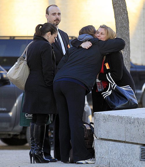 PHIL HOSSACK / WINNIPEG FREE PRESS Happy with the sentence handed down to her sister Gina's killer, Kirsten Swanson is embraced by supporters outside the courthouse Wednesday. Schuyler Vwissen wes convicted of first degree murder and sentenced to life. See Mike McIntyre's story. March 23, 2016