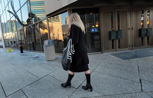 PHIL HOSSACK / WINNIPEG FREE PRESS Kirsten Swanson, sister of Gina, walks away from the courthouse after commenting on the life sentence handed down to her sister's killer Wednesday. See Mike McIntyre's story. March 23, 2016