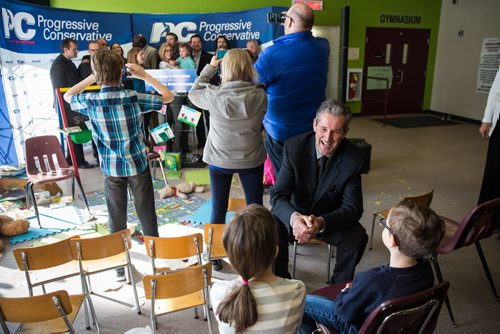 MIKE DEAL / WINNIPEG FREE PRESS PC Leader Brian Pallister talks to Chloe Micklefield, 10 and her brother Ezra Micklefield, 8 after making an education announcement at the Winakwa Community Centre Thursday morning. 160324 - Thursday, March 24, 2016
mbpoli2016deal