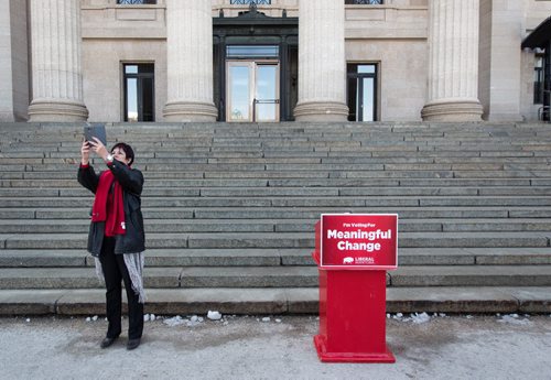 MIKE DEAL / WINNIPEG FREE PRESS Leslie Beck the Liberal MLA candidate for Flin Flon takes a selfie outside the Manitoba Legislative building prior to the start of a Liberal policy announcement. 160324 - Thursday, March 24, 2016