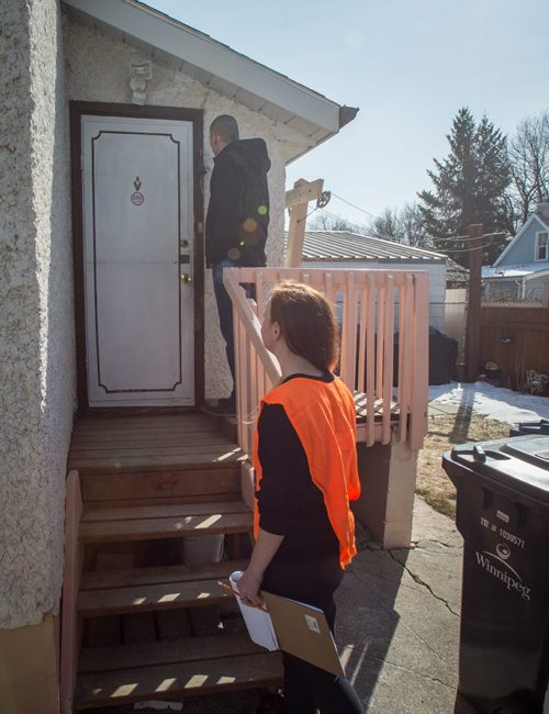 MIKE DEAL / WINNIPEG FREE PRESS NDP candidate Kevin Chief goes door knocking with canvasser Alissa Prevost Thursday afternoon. 160324 - Thursday, March 24, 2016