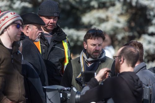 MIKE DEAL / WINNIPEG FREE PRESS Director David Hyde (centre) chats with Michael Edlund (right) and Michael Ironside (left) and other members of the crew during a break in shooting on the last day of filming for the feature film Stegman is Dead in the Leo Mol garden at Assiniboine Park Wednesday. 160323 - Wednesday, March 23, 2016