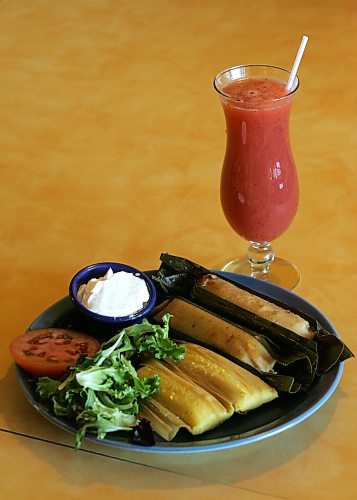 BORIS MINKEVICH/WINNIPEG FREE PRESS  080305 La Fiesta Cafecito. A plate with corn &amp; chicken Tamales. The drink is a home made Kiwi and strawberry fruit drink.