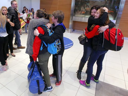 BORIS MINKEVICH / WINNIPEG FREE PRESS Families are happy to see their kids arrive home at James Armstrong Richardson International Airport. Some of the participants on the Winnipeg taekwondo team that arrived at the Brussels airport just minutes after the bombs went off are due back in Winnipeg this afternoon. Photo taken March 24, 2016