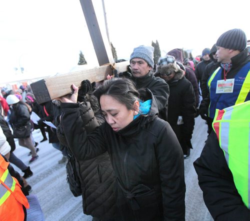 PHIL HOSSACK / WINNIPEG FREE PRESS A thousand strong of the faithfull in a public procession from St Peter's Church on Keewatin street Friday morning to follow the "Stations of the Cross" as Easter weekend begins for Christians world wide. See Scott Billeck story. March 25, 2016