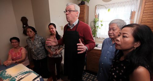 PHIL HOSSACK / WINNIPEG FREE PRESS NDP leader Greg Selinger joined with Marilou Sernadilla (3rd from left) and gher family to prepare a traditional Philippino dish of boiled vegitables Friday and to make an announcement re:the family reunification stream. See Scott Billeck story  March 25, 2016