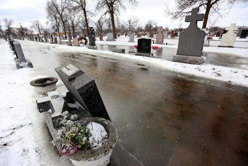 TREVOR HAGAN / WINNIPEG FREE PRESS Headstones have begun tipping over in All Saints Cemetery on Main Street after standing water has softened the ground. For Jay Bell. Possible story, Friday, March 25, 2016.