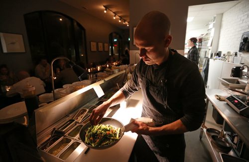 TREVOR HAGAN / WINNIPEG FREE PRESS Chef de Cuisine, Aaron Dreger-Sitar, preparing Pan Fried Greens with XO Sauce, at Maque, Friday, March 25, 2016. For Barley Kives review.