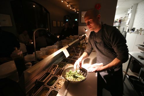 TREVOR HAGAN / WINNIPEG FREE PRESS Chef de Cuisine, Aaron Dreger-Sitar, preparing Pan Fried Greens with XO Sauce, at Maque, Friday, March 25, 2016. For Barley Kives review.