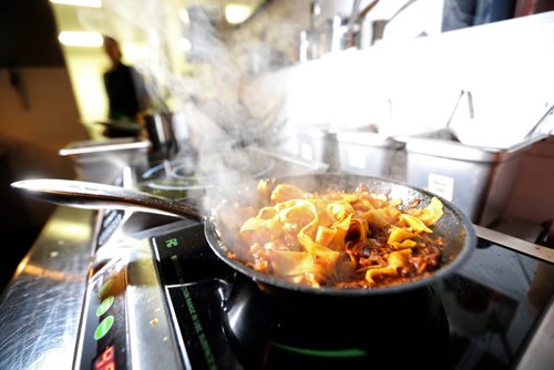 TREVOR HAGAN / WINNIPEG FREE PRESS Chef de Cuisine, Aaron Dreger-Sitar, preparing Mongolian Lamb in Egg Noodles, at Maque, Friday, March 25, 2016. For Barley Kives review.