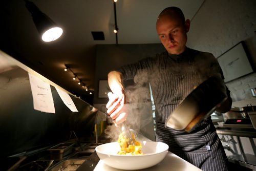 TREVOR HAGAN / WINNIPEG FREE PRESS Chef de Cuisine, Aaron Dreger-Sitar, preparing Mongolian Lamb in Egg Noodles, at Maque, Friday, March 25, 2016. For Barley Kives review.