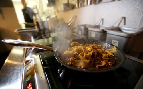 TREVOR HAGAN / WINNIPEG FREE PRESS Chef de Cuisine, Aaron Dreger-Sitar, preparing Mongolian Lamb in Egg Noodles, at Maque, Friday, March 25, 2016. For Barley Kives review.