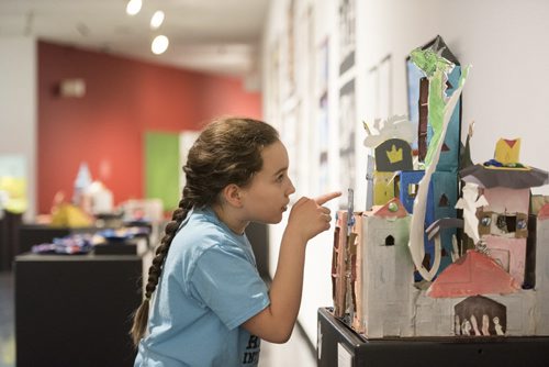 DAVID LIPNOWSKI / WINNIPEG FREE PRESS  Sophie Piché (age 8) checks out 'The Castle' which she helped create, at the WAG Saturday March 26, 2016 as part of an exhibit titled 'Through the Eyes of a Child', which the WAG describes as highlighting the creations of the young people who attend art classes at WAG Studio.