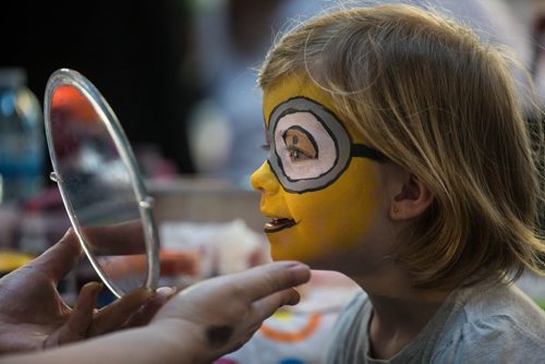 MIKE DEAL / WINNIPEG FREE PRESS Grace, 5, gets her face painted during the Festival of Fools at The Forks on Monday afternoon. 160328 - Monday, March 28, 2016