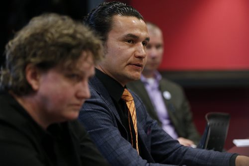 JOHN WOODS / WINNIPEG FREE PRESS Wab Kinew, NDP (Fort Rouge) (centre) speaks as Barb Burkowski, NDP (Transcona) (Left) and Shannon Martin, PC (Morris) listen in at a Pride Winnipeg meeting Monday, March 28, 2016. Manitoba election candidates met with Pride Winnipeg to discuss LGBTQ issues.