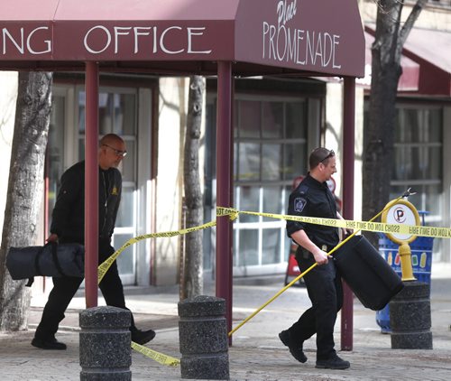 WAYNE GLOWACKI / WINNIPEG FREE PRESS   Members of the Winnipeg Police Bomb unit leave the Place Promenade on Webb Place Tuesday after a report of a grenade was found in the hallway on the 9th floor. It turned out to be airsoft grenade used in paint ball games that  could have caused minor injuries.   March 29 2016