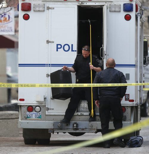 WAYNE GLOWACKI / WINNIPEG FREE PRESS   Members of the Winnipeg Police bomb unit arrive at the Place Promenade on Webb Place Tuesday after a report of a grenade was found in the hallway on the 9th floor. It turned out to be airsoft grenade used in paint ball games that could have caused minor injuries.   March 29 2016