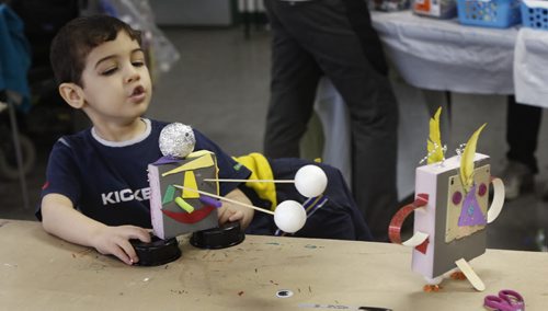 WAYNE GLOWACKI / WINNIPEG FREE PRESS   Anas,3, lines up his robot with his sister's creation during Winnipeg Art Gallery's family fusion event Tuesday called Recycled Robots. The drop-in robot themed workshop was held at the WAG Studio, family members were given supplies and space to create,   March 29 2016