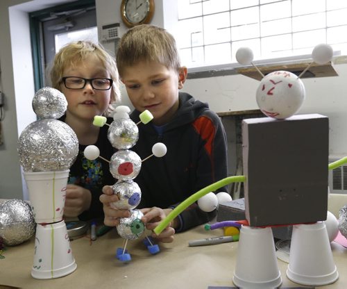 WAYNE GLOWACKI / WINNIPEG FREE PRESS   At right, Jesse and his best friend Owen with some of their robot creations at Winnipeg Art Gallery's family fusion event Tuesday called Recycled Robots. Those attending the drop-in robot themed workshop held at the WAG Studio were given supplies and space to create,   March 29 2016