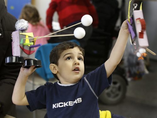 WAYNE GLOWACKI / WINNIPEG FREE PRESS   Anas,3,lines up his robot (left) with his sister's creation during Winnipeg Art Gallery's family fusion event Tuesday called Recycled Robots. The drop-in robot themed workshop was held at the WAG Studio, family members were given supplies and space to create,   March 29 2016