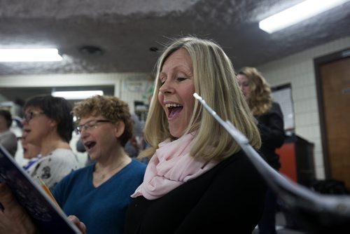 RUTH BONNEVILLE / WINNIPEG FREE PRESS  Susan Lethbridge sings along with Flin Flon's  community choir as they rehearse in  the music room in their local school for upcoming performance at Carnegie Hall in New York in June.   Crystal Kolt, Head of the Flin Flon Arts Council conducts the choir.  Feature story on the vibrant arts community in Flin Flon Manitoba by reporter, Erin Lebar.    March 19, 2016R
