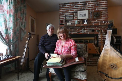 RUTH BONNEVILLE / WINNIPEG FREE PRESS  Crystal and her husband Mark Kolt, look over a large binder in their home of historical photos from Flin Flon's rich history of arts.   Crystal is Head of the Flin Flon Arts Council and her husband Mark is very involved in musical productions in the city.    Feature story on the vibrant arts community in Flin Flon Manitoba by reporter, Erin Lebar.     March 19, 2016