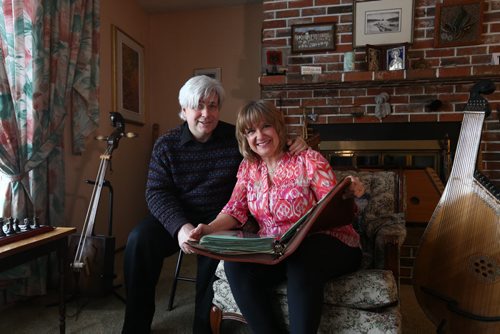 RUTH BONNEVILLE / WINNIPEG FREE PRESS  Crystal and her husband Mark Kolt, look over a large binder in their home of historical photos from Flin Flon's rich history of arts.   Crystal is Head of the Flin Flon Arts Council and her husband Mark is very involved in musical productions in the city.    Feature story on the vibrant arts community in Flin Flon Manitoba by reporter, Erin Lebar.    March 19, 2016