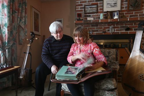 RUTH BONNEVILLE / WINNIPEG FREE PRESS  Crystal and her husband Mark Kolt, look over a large binder in their home of historical photos from Flin Flon's rich history of arts.   Crystal is Head of the Flin Flon Arts Council and her husband Mark is very involved in musical productions in the city.    Feature story on the vibrant arts community in Flin Flon Manitoba by reporter, Erin Lebar.    March 19, 2016