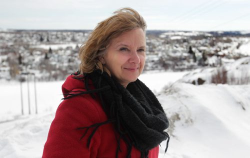 RUTH BONNEVILLE / WINNIPEG FREE PRESS  Crystal Kolt, Head of the Flin Flon Arts Council looks out over her town from a high ridge in town.   Feature story on the vibrant arts community in Flin Flon Manitoba by reporter, Erin Lebar.    March 19, 2016
