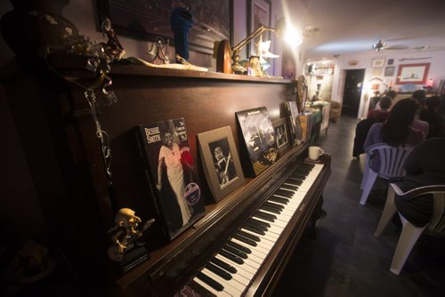 RUTH BONNEVILLE / WINNIPEG FREE PRESS  A piano is covered with photos of musicians in Ann Ross and Doug McGregor's home where they are hosting  - Home Routes show,  a gathering in a local home where novice performers have an opportunity to perform in front of a audience.   Feature story on the vibrant arts community in Flin Flon Manitoba by reporter, Erin Lebar.    March 19, 2016