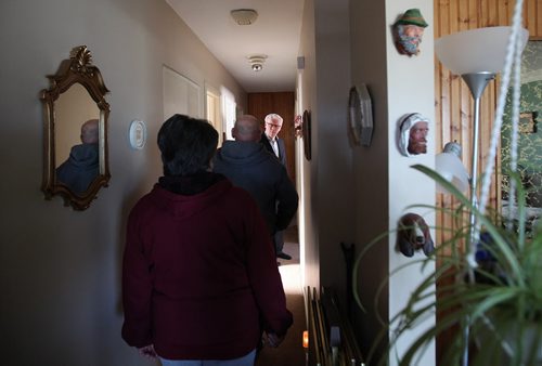 RUTH BONNEVILLE / WINNIPEG FREE PRESS  NDP leader Greg Selinger talks homeowners, Cliff and Bev Bernhardt inside their home in Elmwood before holding press conference in front of their home  announcing he will protect Mb. Hydro from privatization and help families save money on utility bills Wednesday. March 30, 2016