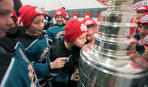 PHIL HOSSACK / WINNIPEG FREE PRESS YES IT'S THE REAL THING! - Lev Kohn (left) leans in to kiss the Stanley Cup for the Tuxedo Lightning Hockey team Wednesday afternoon at the IcePlex. The trophy visited via the ScotiaBank's continued commitment to kids community hockey in Canada. See release pasted below....MARCH 30, 2016  Scotiabank to surprise local minor hockey team with the Stanley Cup®  Winnipeg, MB  Monday March 28, 2016  Members of the Tuxedo Lightning 10 A2 hockey team will receive an unforgettable surprise this Wednesday when Scotiabank brings the players face-to-face with the Stanley Cup® before their hockey practice. The surprise is part of Scotiabanks continued commitment to kids community hockey in Canada.  Stanley Cup® Surprise Details   WHAT: Scotiabank to surprise the Tuxedo Lightning 10 A2 hockey team with the Stanley Cup®  WHO: Tuxedo Lightning 10 A2 hockey team *Scotiabank representatives will be on-site for interviews  WHEN: Wednesday March 30, 2016 at 5:15 p.m. Team practice from 5:30 p.m.  6:15 p.m. *We ask media to arrive by 4:50 p.m. **To keep the event a surprise, please contact Lauren Ackley upon arrival (contact details below).  WHERE: MTS Iceplex 3969 Portage Ave. Winnipeg, MB R3K 1W4  -30-  Media Contact:  Lauren Ackley Narrative PR (416) 895-9733 lauren.ackley@narrative.ca  Amy Van Kessel S&E Sponsorship Group (on-site contact) (647) 382-1919 avankessel@sesponsorshipgroup.com
