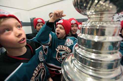 PHIL HOSSACK / WINNIPEG FREE PRESS YES IT'S THE REAL THING! - 10-year-old Lev Kohn (center) celebrates a suprise presentation of the Stanley Cup with his Tuxedo Lightning Hockey team Wednesday afternoon at the IcePlex. The trophy visited via the ScotiaBank's continued commitment to kids community hockey in Canada. See release pasted below....MARCH 30, 2016  Scotiabank to surprise local minor hockey team with the Stanley Cup®  Winnipeg, MB  Monday March 28, 2016  Members of the Tuxedo Lightning 10 A2 hockey team will receive an unforgettable surprise this Wednesday when Scotiabank brings the players face-to-face with the Stanley Cup® before their hockey practice. The surprise is part of Scotiabanks continued commitment to kids community hockey in Canada.  Stanley Cup® Surprise Details   WHAT: Scotiabank to surprise the Tuxedo Lightning 10 A2 hockey team with the Stanley Cup®  WHO: Tuxedo Lightning 10 A2 hockey team *Scotiabank representatives will be on-site for interviews  WHEN: Wednesday March 30, 2016 at 5:15 p.m. Team practice from 5:30 p.m.  6:15 p.m. *We ask media to arrive by 4:50 p.m. **To keep the event a surprise, please contact Lauren Ackley upon arrival (contact details below).  WHERE: MTS Iceplex 3969 Portage Ave. Winnipeg, MB R3K 1W4  -30-  Media Contact:  Lauren Ackley Narrative PR (416) 895-9733 lauren.ackley@narrative.ca  Amy Van Kessel S&E Sponsorship Group (on-site contact) (647) 382-1919 avankessel@sesponsorshipgroup.com