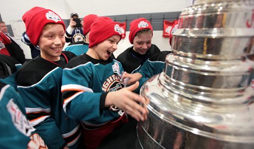 PHIL HOSSACK / WINNIPEG FREE PRESS YES IT'S THE REAL THING! - 10 yr old Eamon Wallace (center) and Lev Kohn (lefta) react to a suprise presentation of the Stanley Cup for the Tuxedo Lightning Hockey team Wednesday afternoon at the IcePlex. The trophy visited via the ScotiaBank's continued commitment to kids community hockey in Canada. See release pasted below....MARCH 30, 2016  Scotiabank to surprise local minor hockey team with the Stanley Cup®  Winnipeg, MB  Monday March 28, 2016  Members of the Tuxedo Lightning 10 A2 hockey team will receive an unforgettable surprise this Wednesday when Scotiabank brings the players face-to-face with the Stanley Cup® before their hockey practice. The surprise is part of Scotiabanks continued commitment to kids community hockey in Canada.  Stanley Cup® Surprise Details   WHAT: Scotiabank to surprise the Tuxedo Lightning 10 A2 hockey team with the Stanley Cup®  WHO: Tuxedo Lightning 10 A2 hockey team *Scotiabank representatives will be on-site for interviews  WHEN: Wednesday March 30, 2016 at 5:15 p.m. Team practice from 5:30 p.m.  6:15 p.m. *We ask media to arrive by 4:50 p.m. **To keep the event a surprise, please contact Lauren Ackley upon arrival (contact details below).  WHERE: MTS Iceplex 3969 Portage Ave. Winnipeg, MB R3K 1W4  -30-  Media Contact:  Lauren Ackley Narrative PR (416) 895-9733 lauren.ackley@narrative.ca  Amy Van Kessel S&E Sponsorship Group (on-site contact) (647) 382-1919 avankessel@sesponsorshipgroup.com